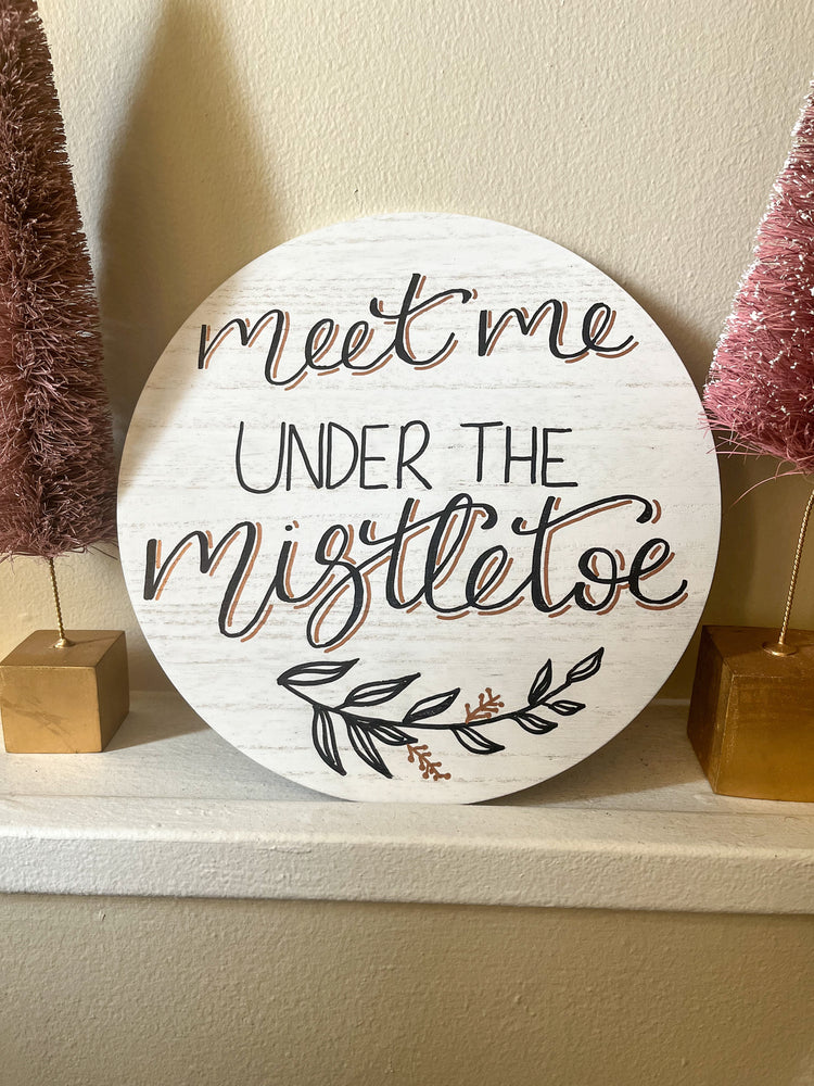 Meet me under the mistletoe wood sign