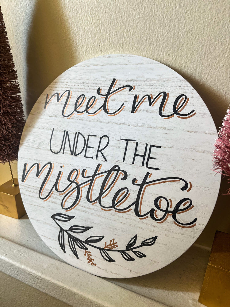 Meet me under the mistletoe wood sign